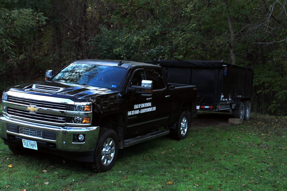 Load Up Junk Removal lettered pickup truck and dump trailer